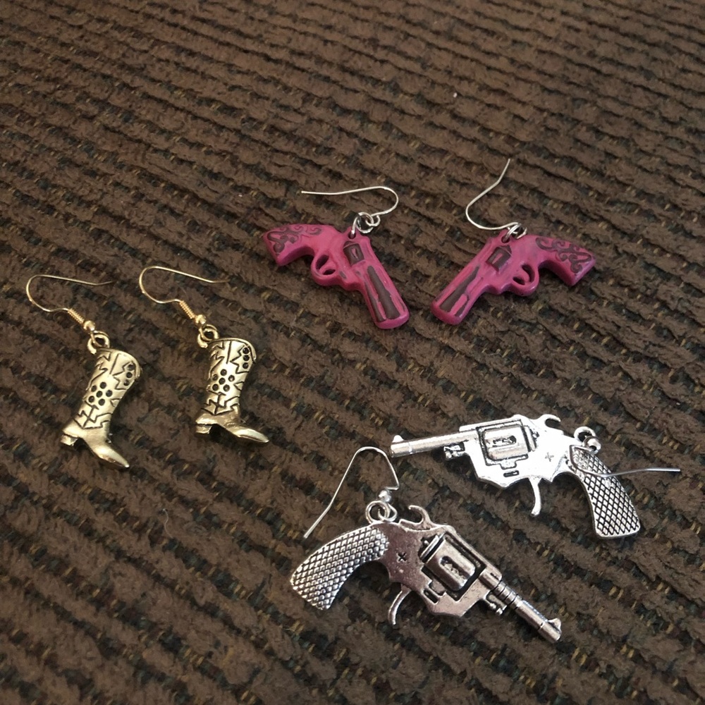 Guns and boot earrings.